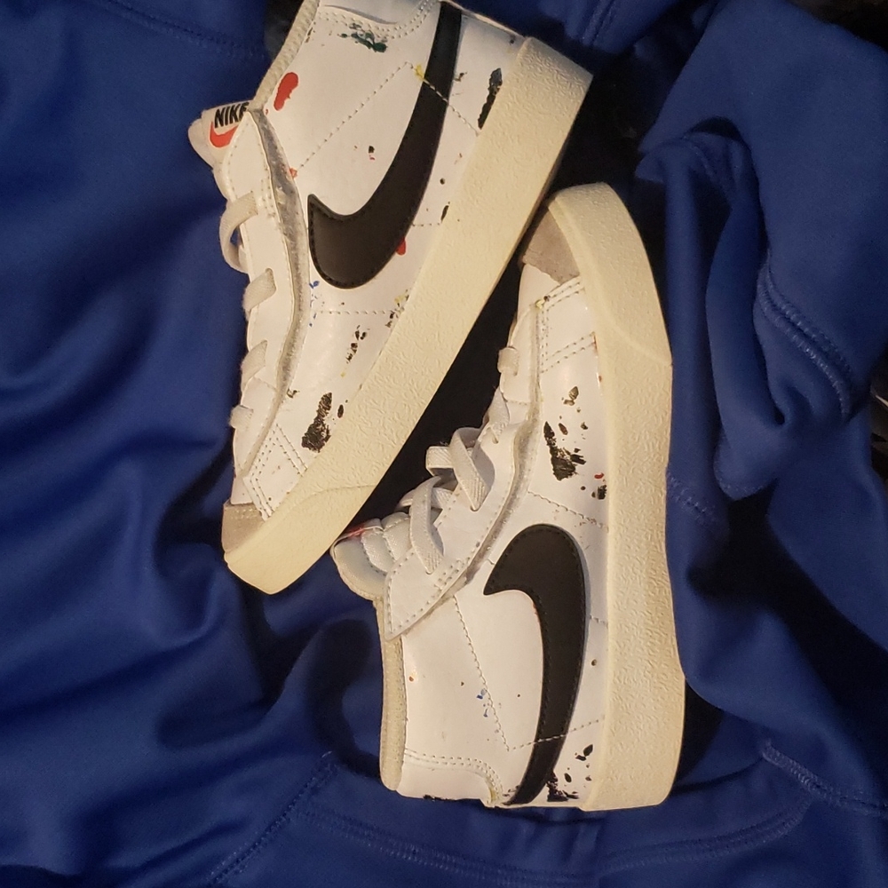Nike Blazer mid., size 9c, white with black swoosh and splatter paint.